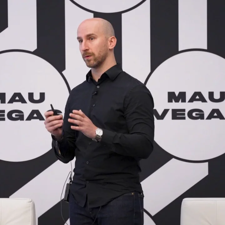 Anthony Scarpaci speaking on stage at MAU Vegas
